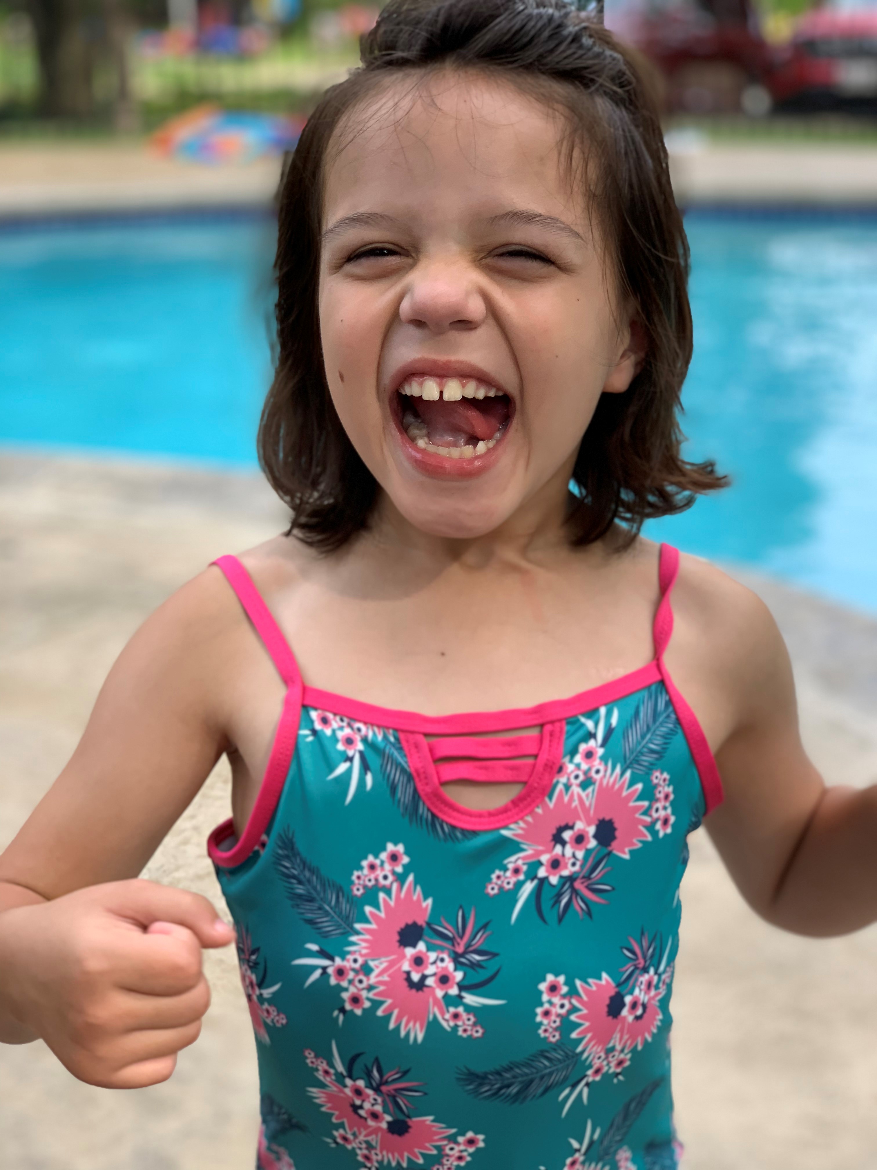 Cassandra big smile by pool